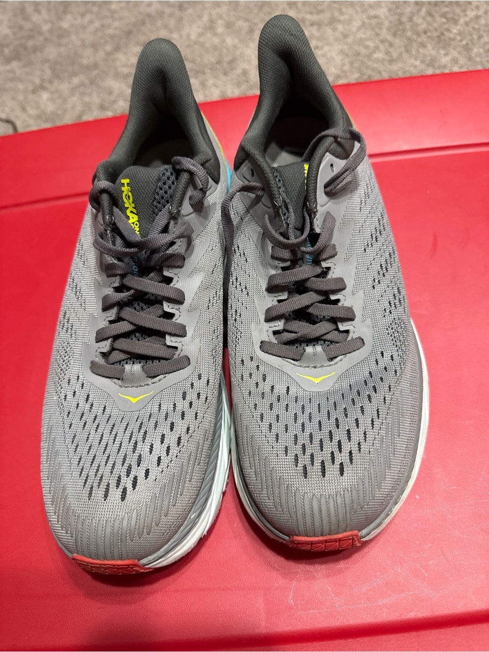 Hoka One One Men's Gray Athletic Shoes with Yellow and Red Accents